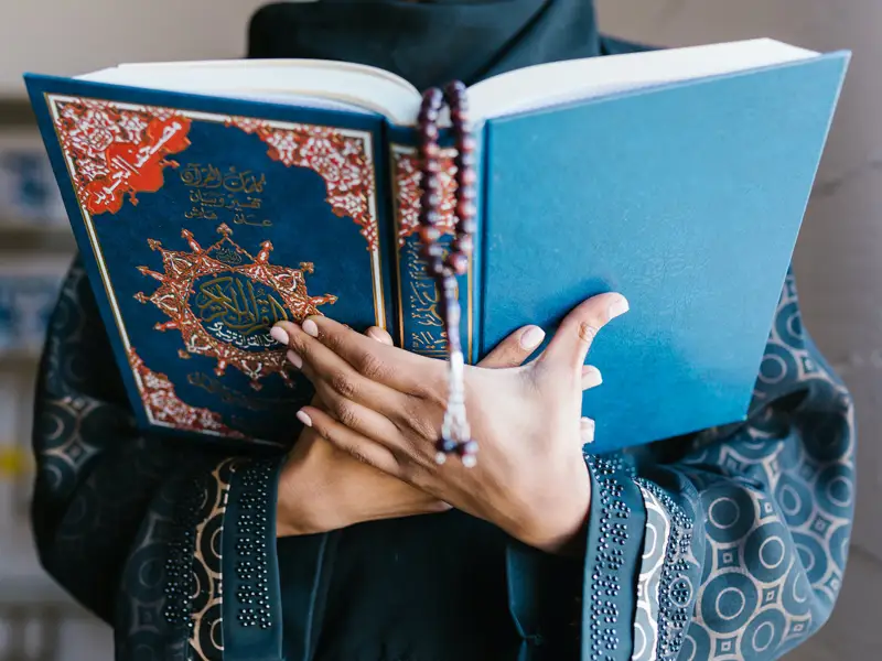 Boy reading Quran